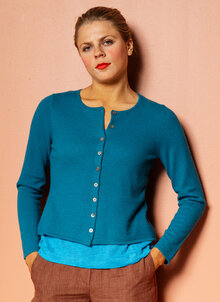 Turkos nätt ullkofta. Rundhalsad, lång ärm. K&US